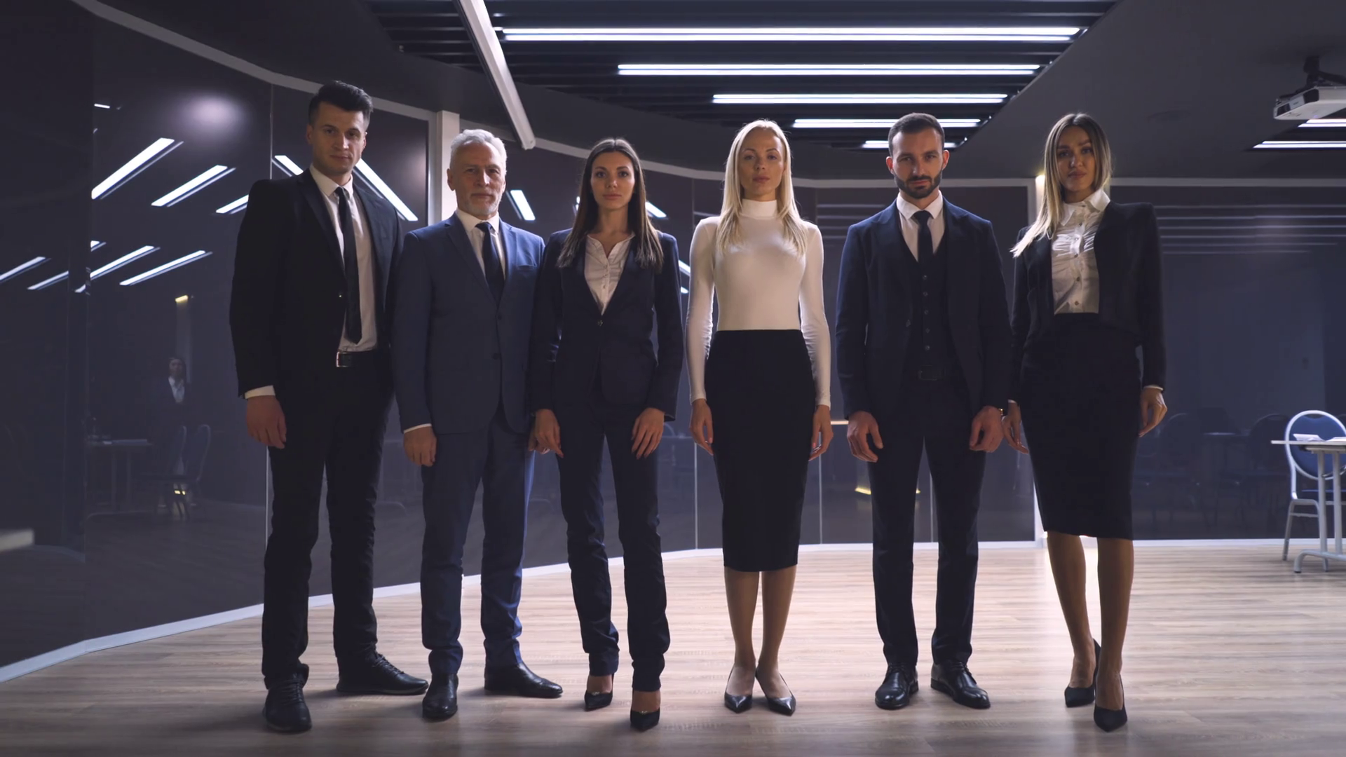 The happy business team of six posing on camera in the office Stock ...