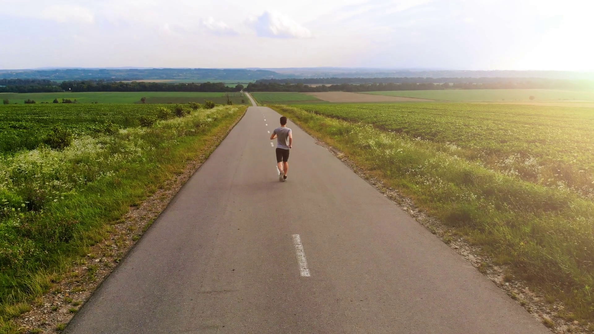 The Sportsman Running On Road On Sunset Stock Footage SBV-325625576