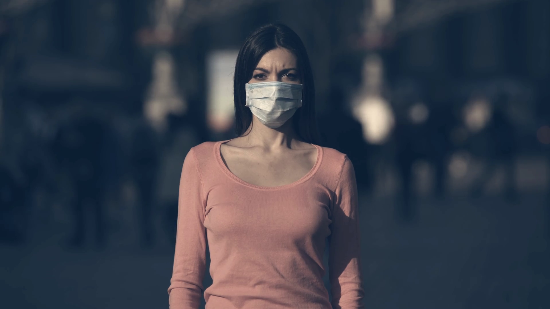 The young woman with medical face mask stands in a crowded street Stock Video Footage 0013 SBV