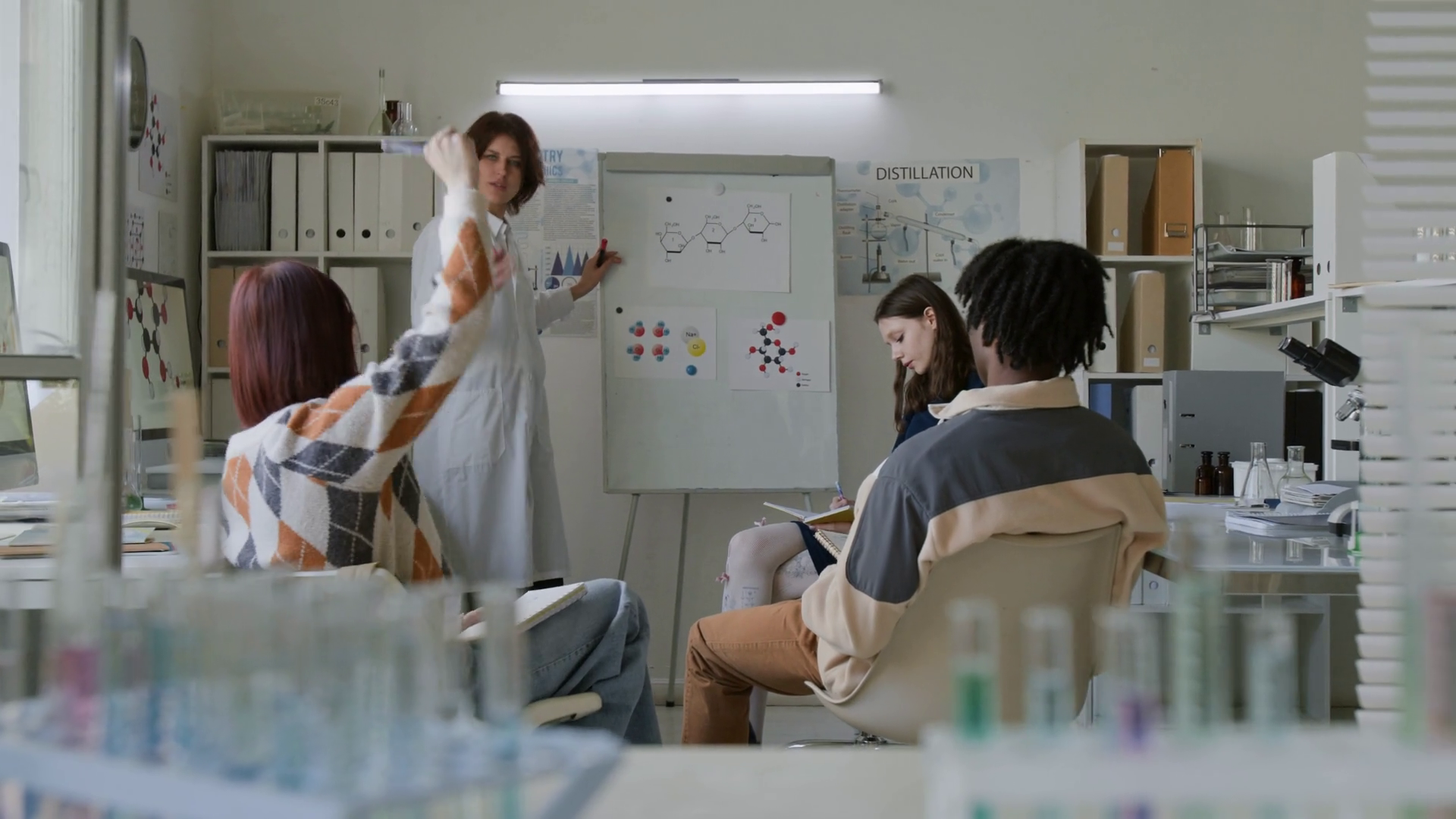 Female Teacher In Lab Coat Explaining Stock Footage SBV-352381478 ...