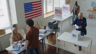 High angle view of American citizens voting at polling place during Election day