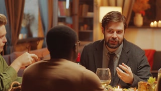 Friends enjoying a festive dinner and conversation