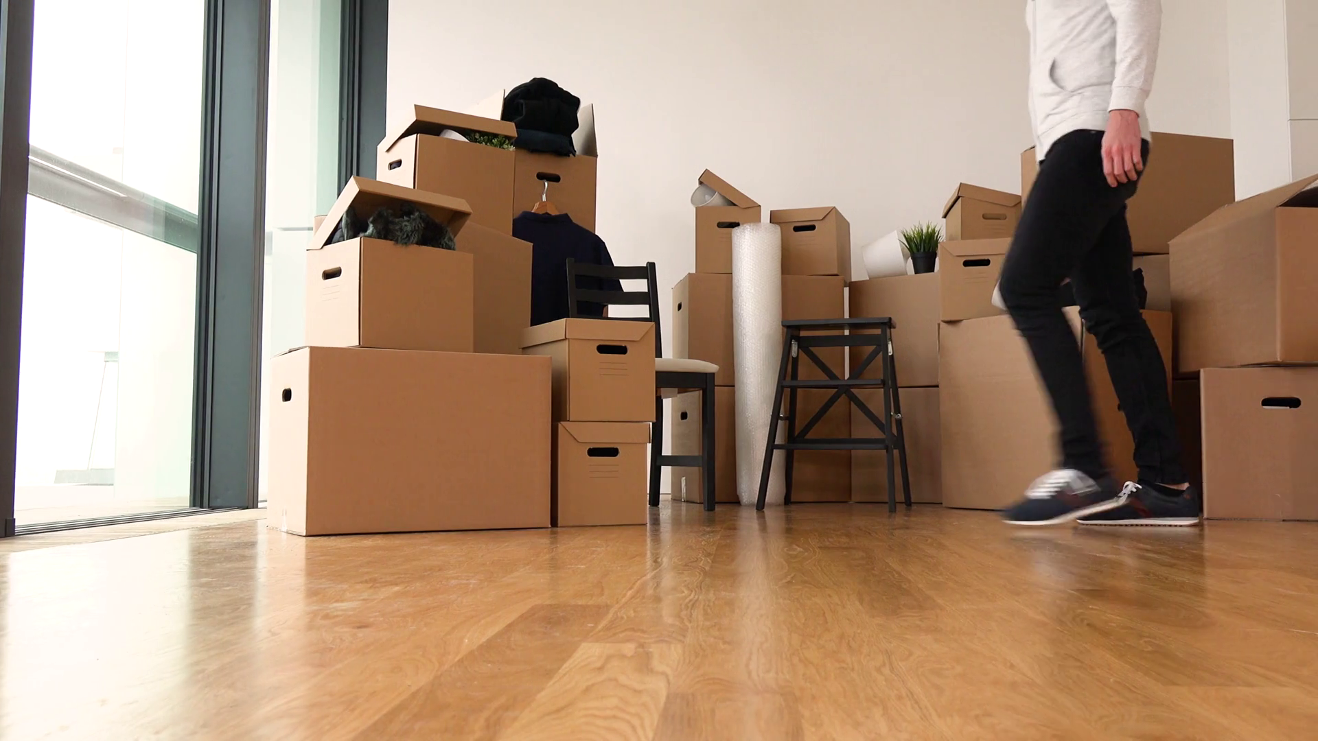 A Moving Man Picks Up Cardboard Box Carries Stock Footage SBV337226889