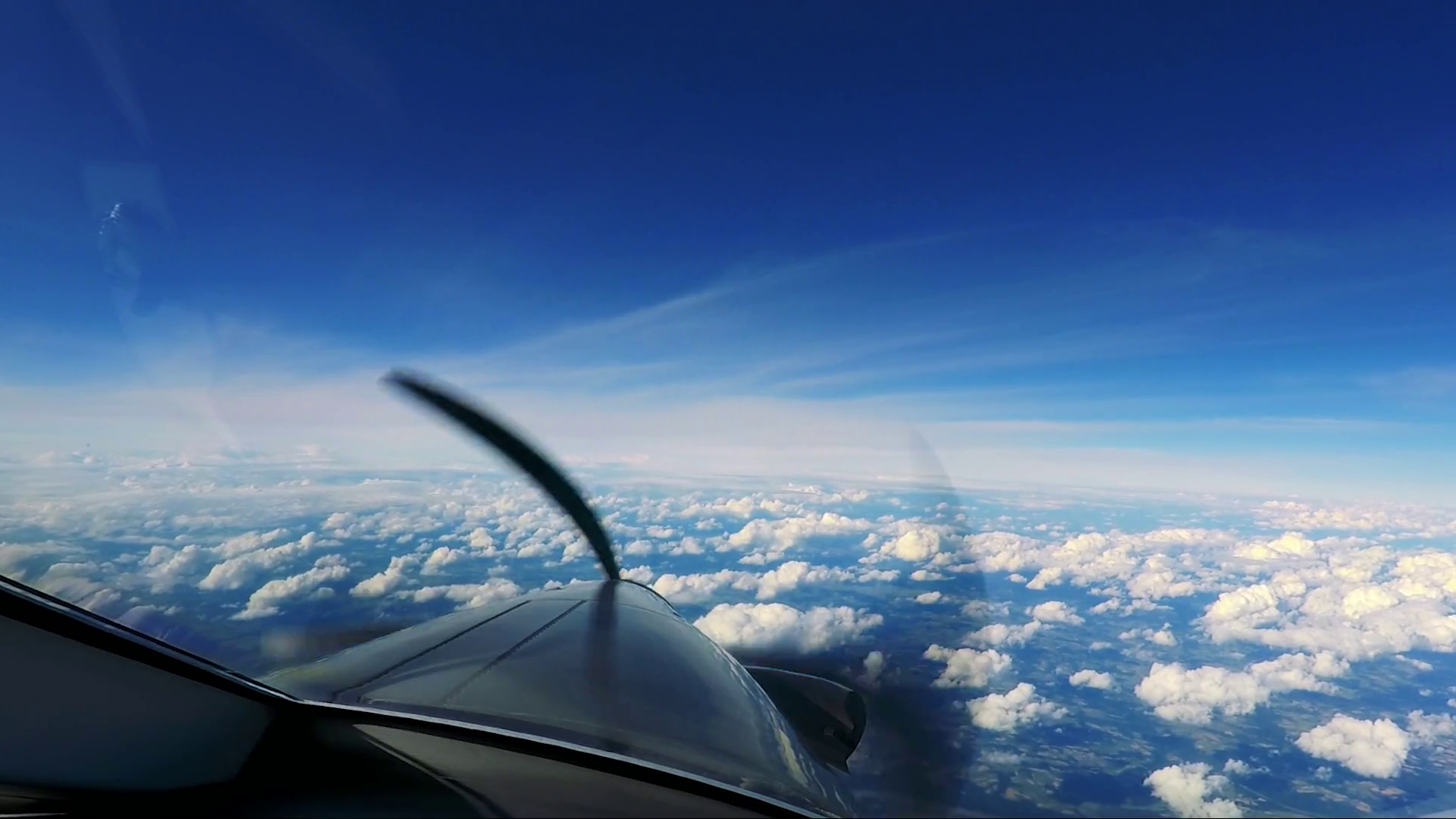 A private plane flies above the clouds a view from the cockpit