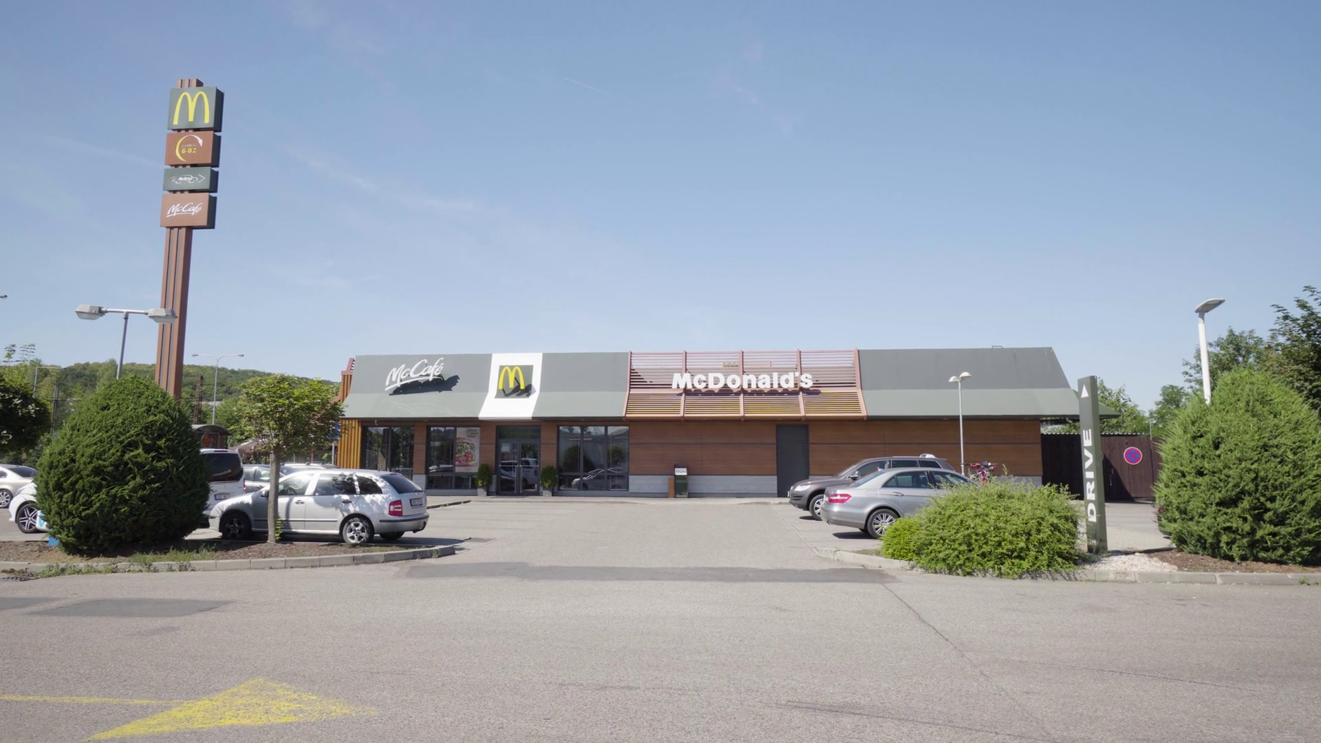 McDonald's diner and parking lot in an urban area Stock Video Footage