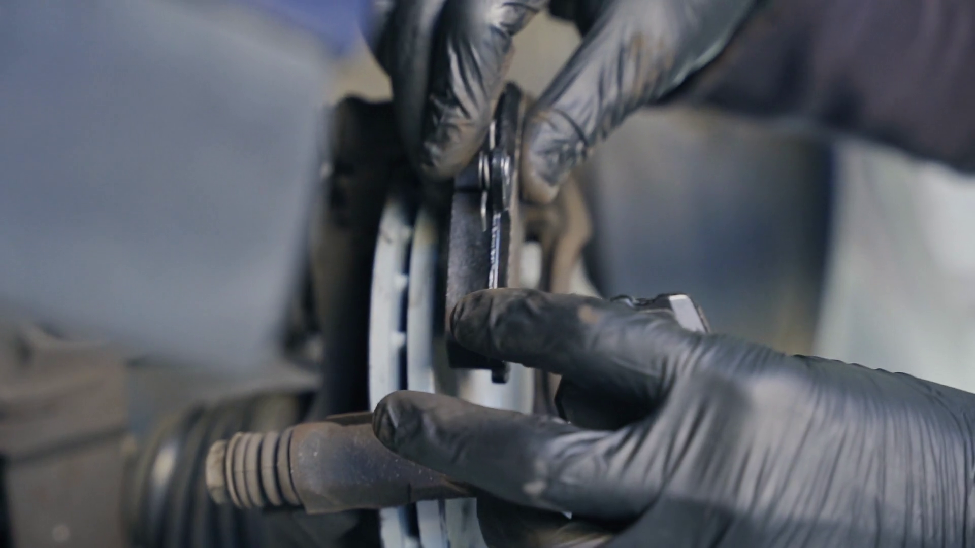 Mechanic Changing Brake Pads On Car Wheel Stock Footage SBV347774046