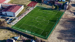 Freshly prepared football field in morning light