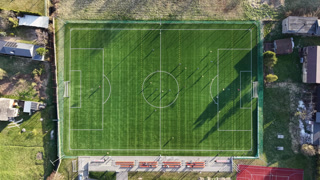 Aerial view of a vibrant green football field