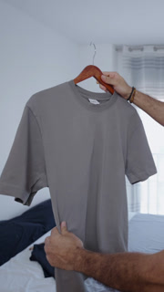 Grey tshirt studied by a muscular guy