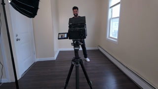 Handheld shot of man talking during recording in studio