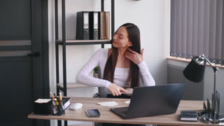 Combs hair. Businesswoman that in formal clothes is in the office