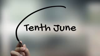 Tenth June Handwriting With Black Marker On Glass Surface