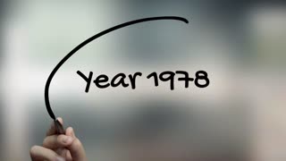 Year 1978 Handwriting With Black Marker On Glass Surface