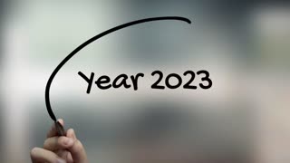 Year 2023 Handwriting With Black Marker On Glass Surface