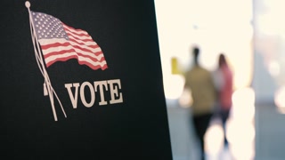 Voters Walking Into A Voting Center