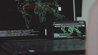 Global cyber attack with world map on mobile phone and computer screen. Internet network communication under cyberattack. Worldwide
