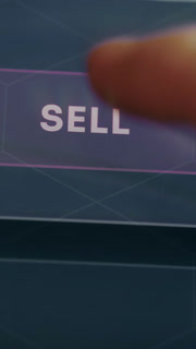 Finger taps the SELL button, initiating the selling action