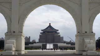 Chiang Kaishek Memorial Hall framed by arch in Taipei Taiwan on a cloudy day