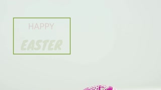 Green line drawing frame as painted egg rolling in, settling, showing Easter greeting for marketing