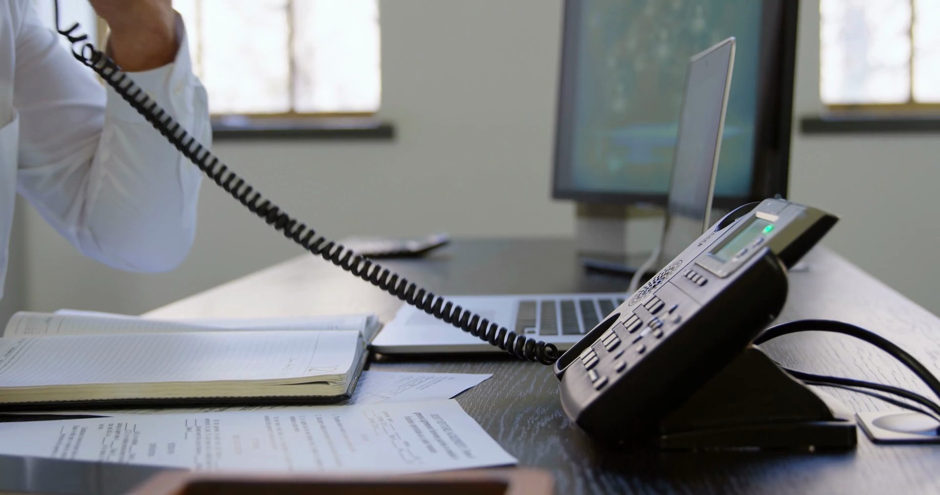 Executive Putting Down Phone Receiver At Stock Footage SBV346577356