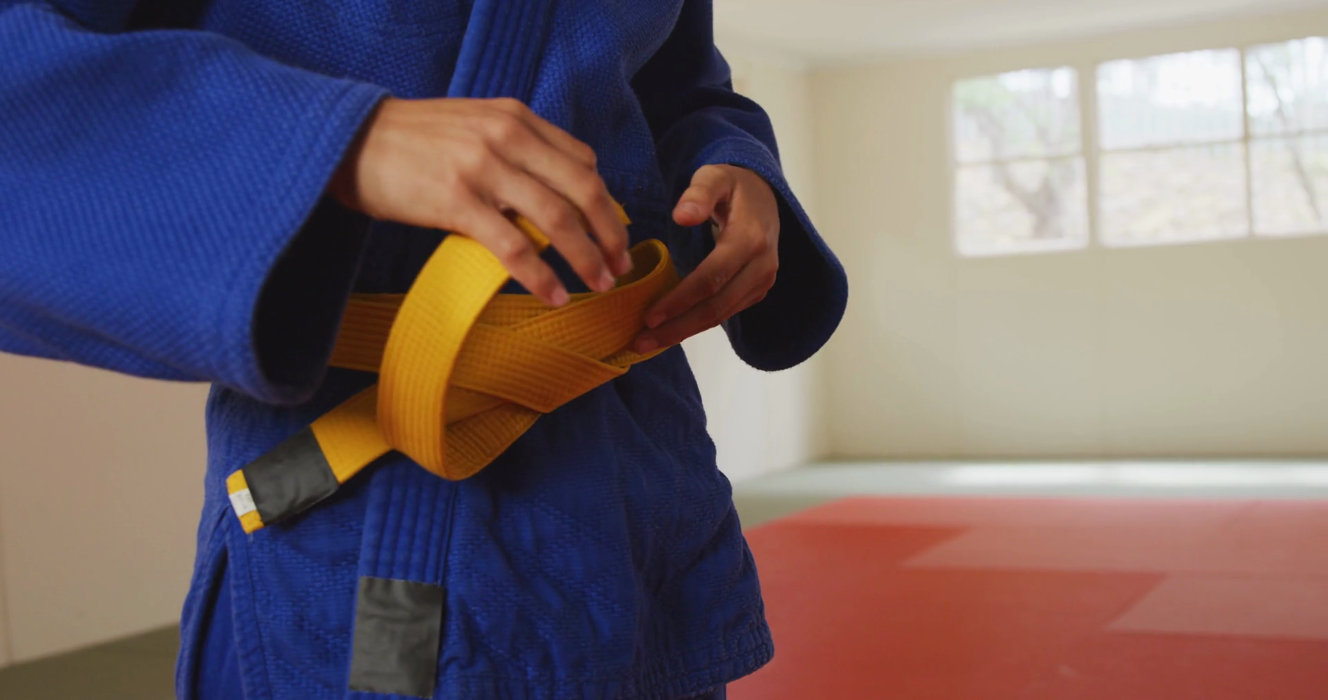 Judoka putting on the yellow belt Stock Video Footage Storyblocks