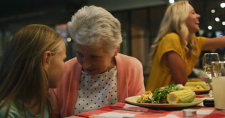 Happy family eating dinner together.