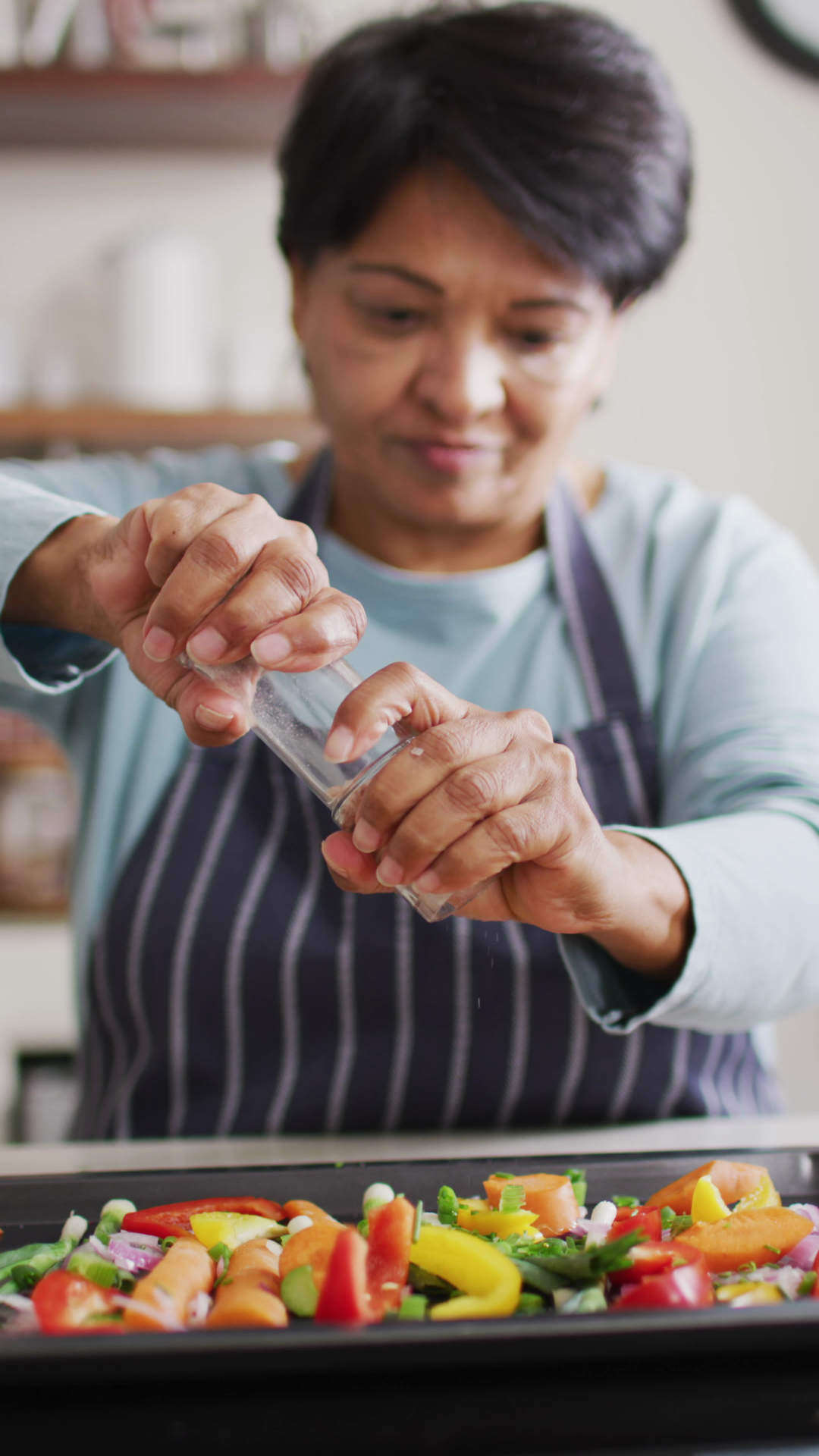 Vertical Video Of Senior Woman Cooking In Stock Footage SBV-353147150 ...