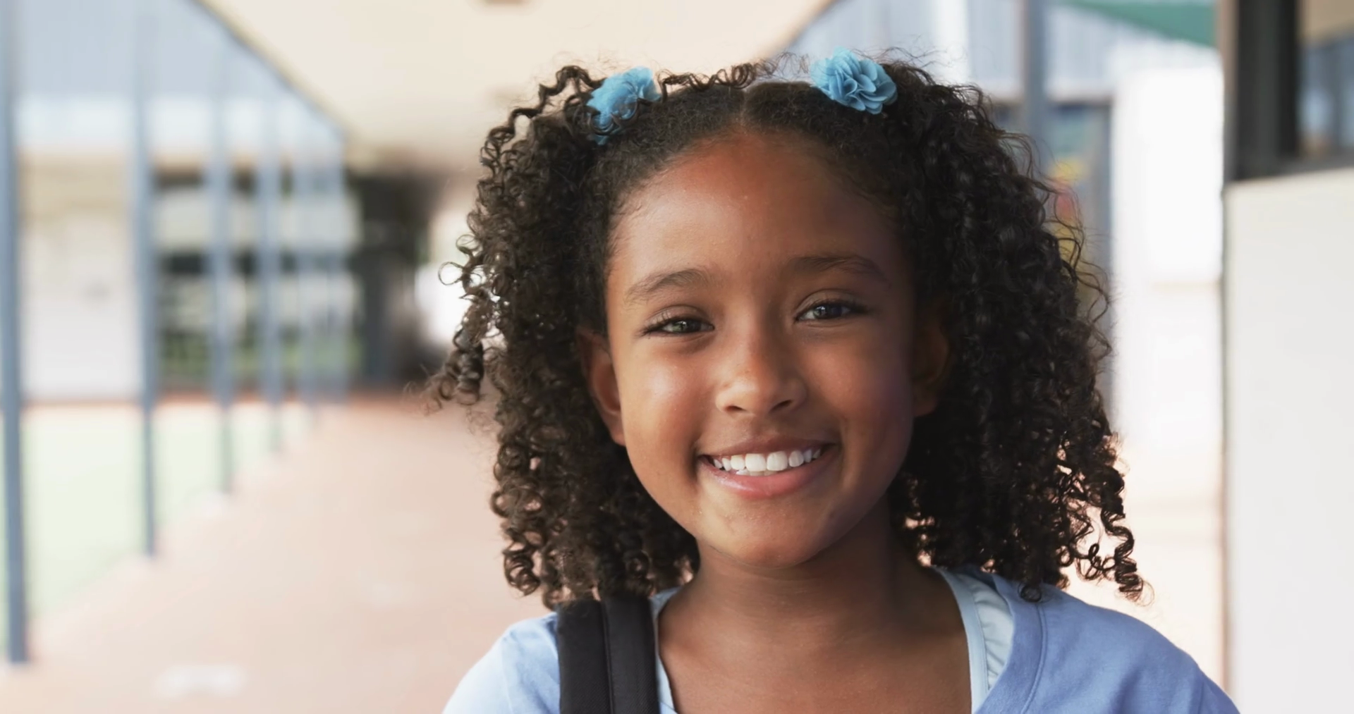 Biracial Girl With Curly Hair Smiles At Stock Footage SBV-352009277 ...