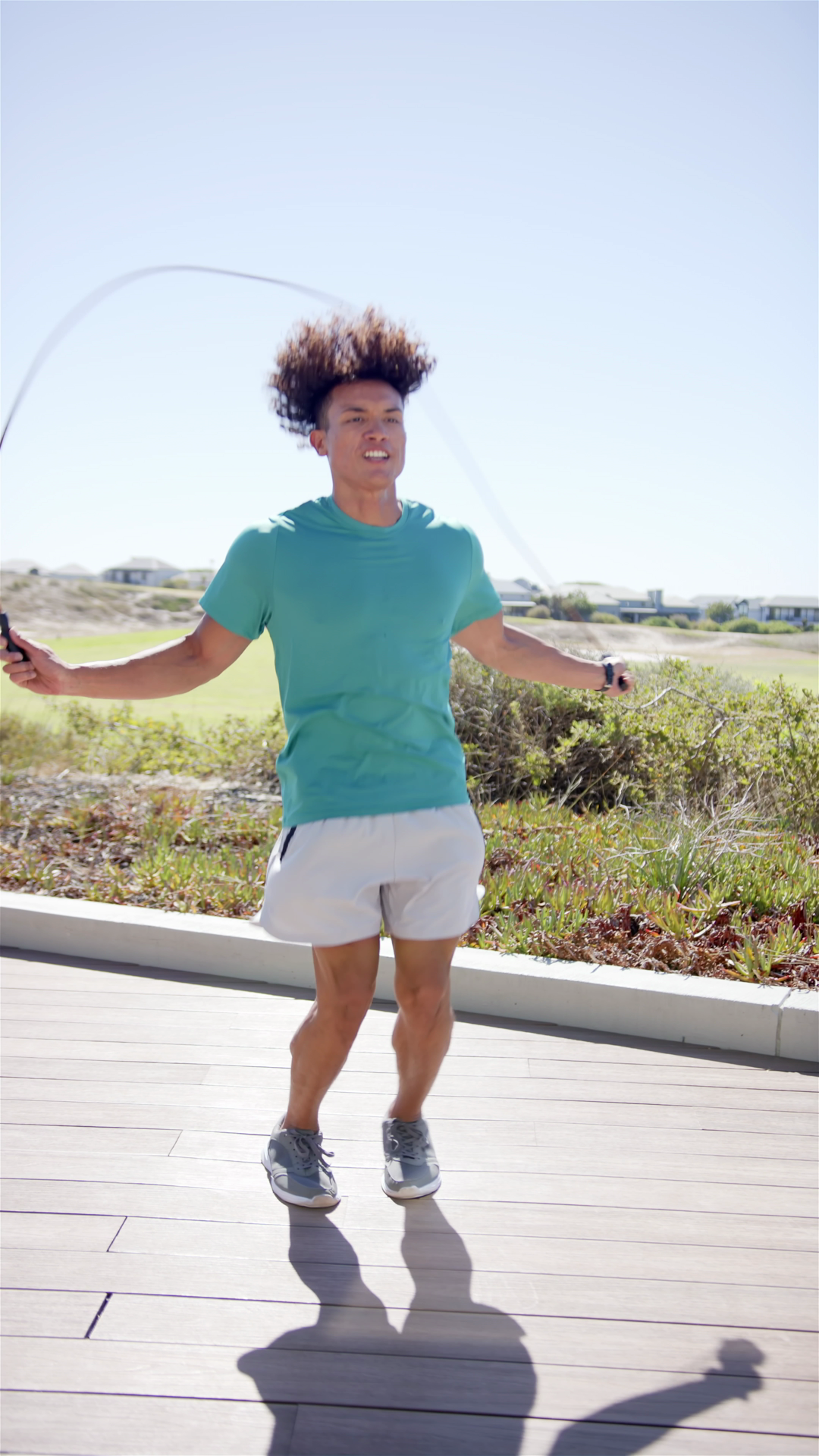 Vertical Video: Young Man Skipping Rope Blue Stock Footage SBV ...