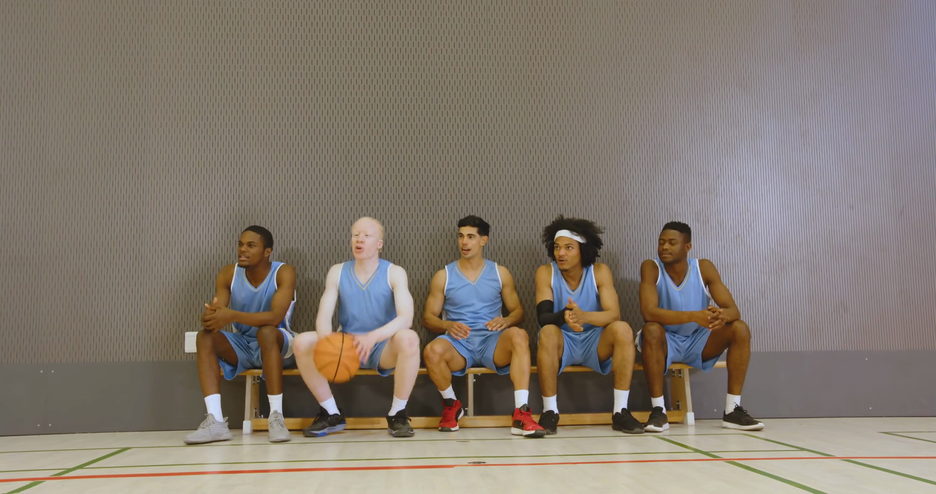 Basketball Team Sitting On Bench Wearing Stock Footage SBV-352064155 ...