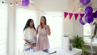 Family preparing traditional ceremony and speech with food on table, decorations