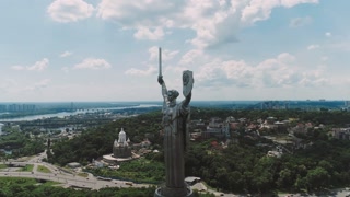 Aerial View of Motherland - Steel Sculpture From Times of USSR and Cityscape in Background. Monument Is Made of Stainless Steel and Is Located on Bank of Dnieper River, Kiev, Ukraine.