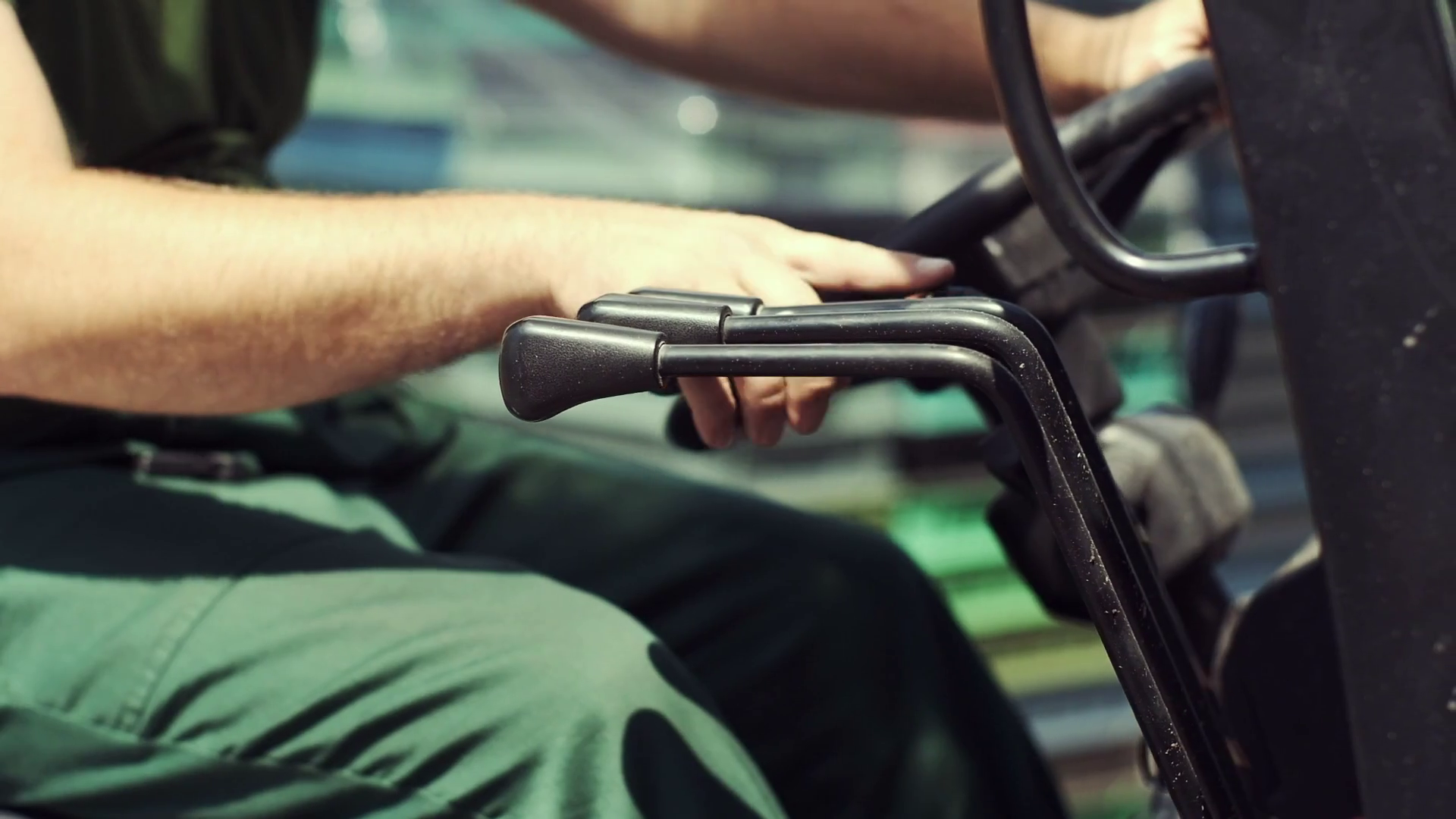 Closeup. Man Working On A Forklift. The Driver Switches The Levers On