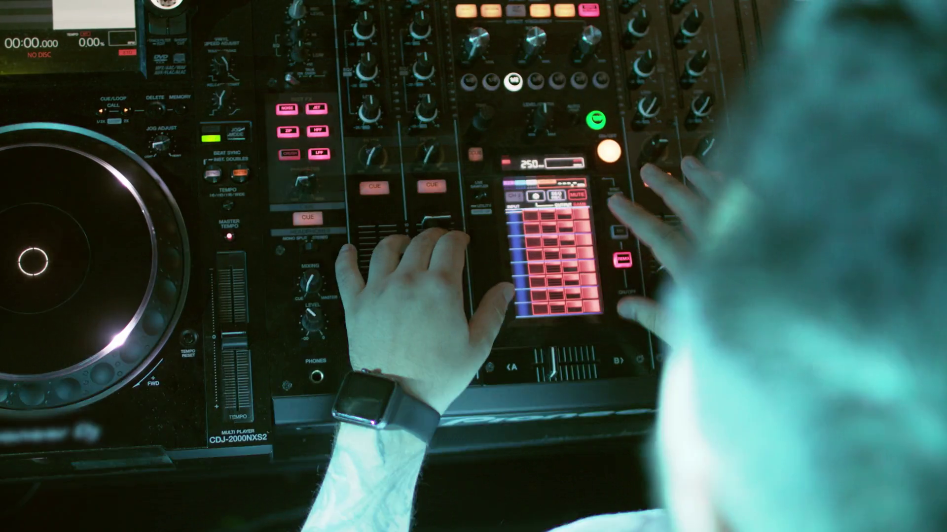 Dj Behind The Console On Stage Perform In Party Concert Live Show Audio Mixer Mix And Scratch Hands Of A Dj On Vinyl And Mixer Knobs Mixing Tracks In Atmospheric Dance Party