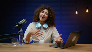 Young female podcaster streaming live talk show