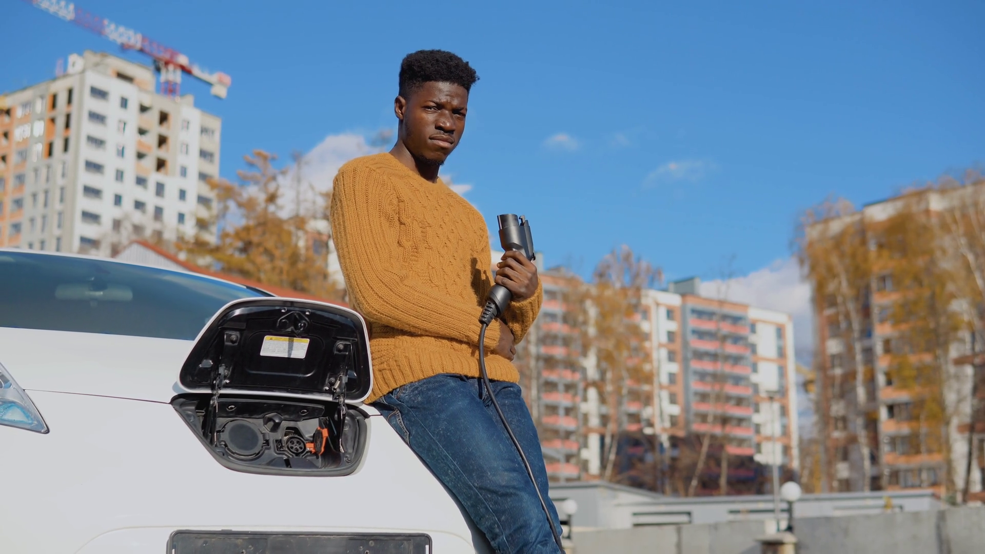 A Dark-skinned Male Driver Holds Charging Stock Footage SBV-352309910 ...