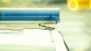 Flashing flasher on the roof of a police car. Blinker. Close-up.