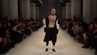 Male model on the catwalk during a fashion show in Kyiv, Ukraine