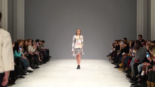 Model demonstrates clothes at a fashion show in Kyiv, Ukraine, slow motion
