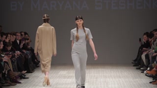 Model demonstrates clothes at a fashion show in Kyiv, Ukraine, slow motion