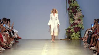 Model demonstrates clothes at a fashion show in Kyiv, Ukraine, slow motion