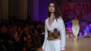 Model demonstrates clothes at a fashion show in Kyiv, Ukraine, slow motion