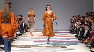 Model demonstrates clothes at a fashion show in Kyiv, Ukraine, slow motion