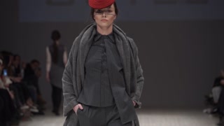 Model demonstrates clothes at a fashion show in Kyiv, Ukraine, slow motion