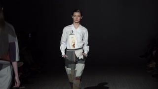 Model demonstrates clothes at a fashion show in Kyiv, Ukraine, slow motion