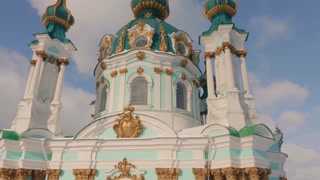 St Andrews church on blue sky background. Amazing decorative facade of cathedral.