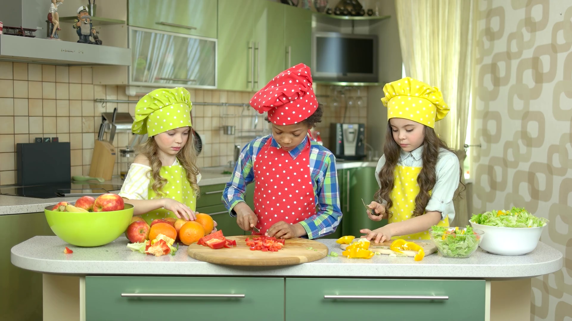 Children cutting vegetables. Fresh fruit on the table. Cooking school