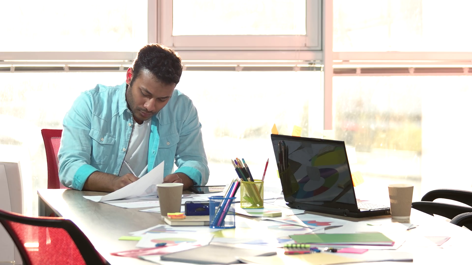 Creating new logo concept. Designer drawing sketches and creating new