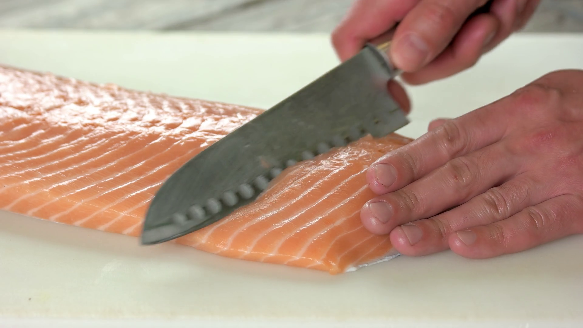 Hands cutting salmon. Raw fish close up. Stock Video Footage 0007 SBV