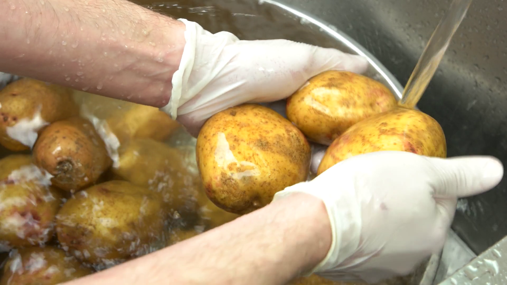 Hands Washing Potatoes In Bowl Vegetables Stock Footage SBV320475555